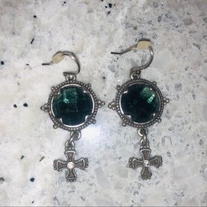 Silver earrings with greenish stone.